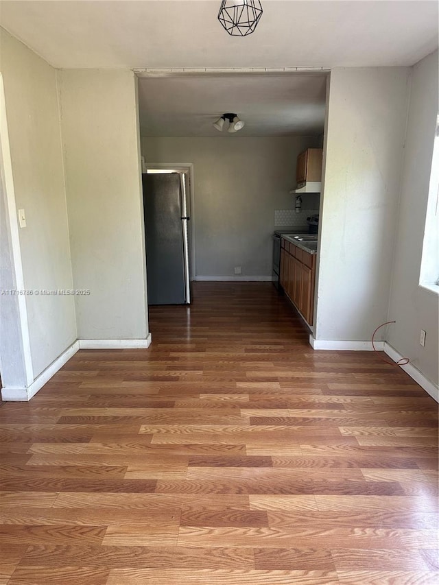 kitchen featuring light hardwood / wood-style floors and stainless steel refrigerator