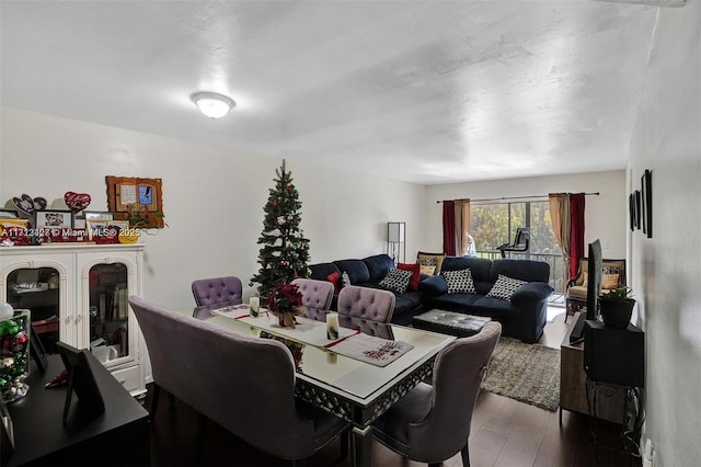 dining space with hardwood / wood-style flooring