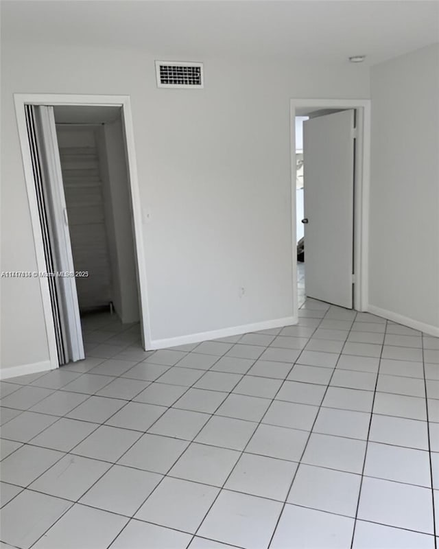 1020 94th St Unit 203, Bay Harbor Islands, FL 33154 - unfurnished room with light tile patterned floors