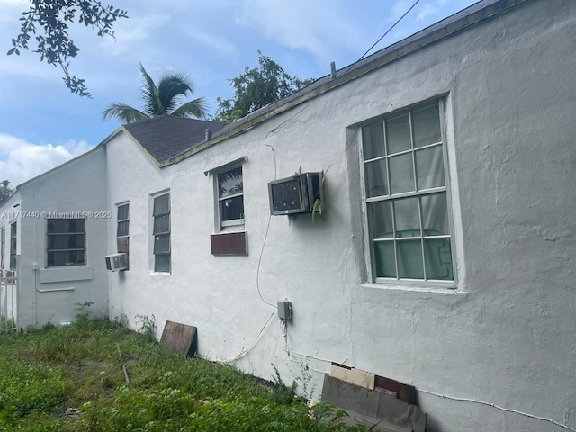 view of side of property featuring cooling unit