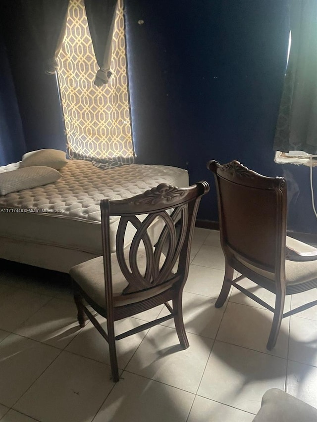 bedroom featuring light tile patterned floors