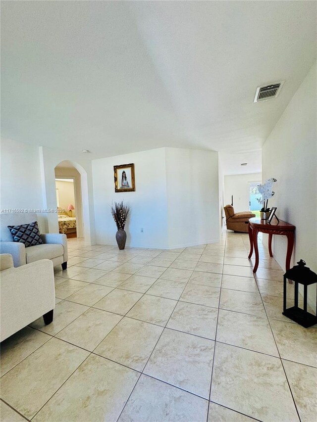 corridor featuring light tile patterned flooring