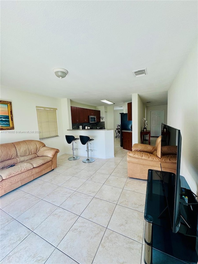 living room featuring light tile patterned flooring