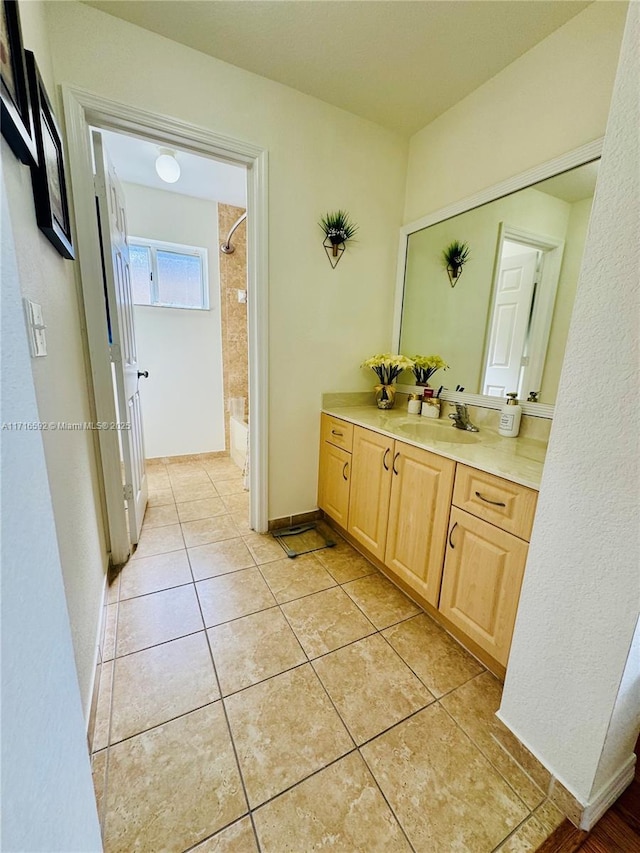 bathroom featuring tile patterned flooring and vanity