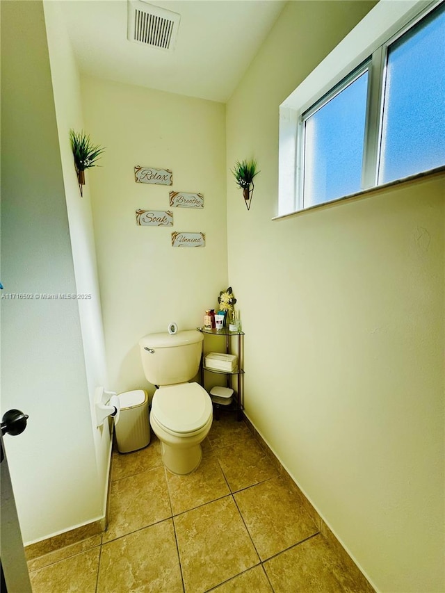 bathroom featuring tile patterned flooring and toilet