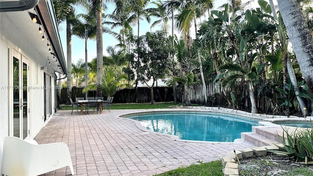 view of swimming pool with a patio