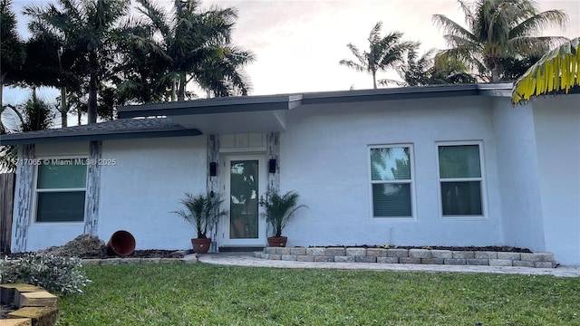 ranch-style house with a front yard