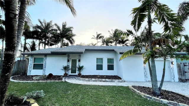 ranch-style house with a front lawn