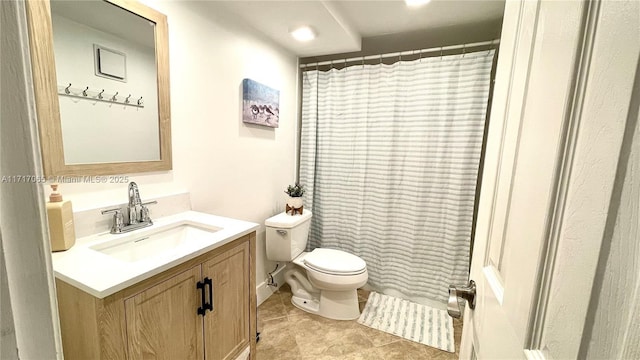 bathroom featuring a shower with curtain, vanity, toilet, and tile patterned floors