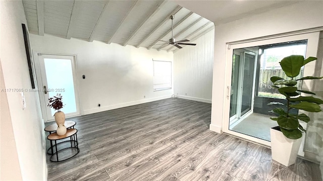 spare room with ceiling fan, wooden ceiling, lofted ceiling with beams, and wood-type flooring