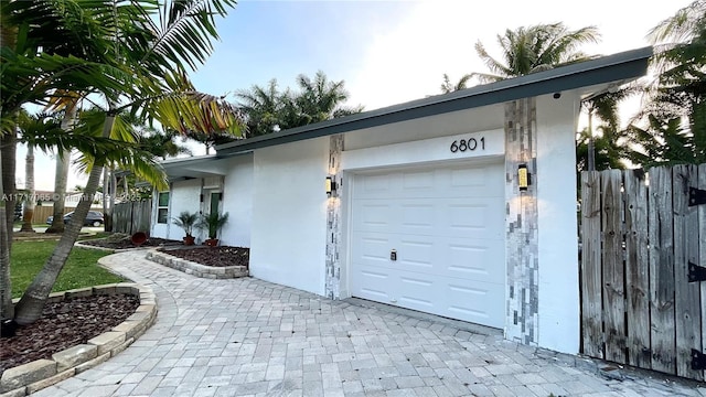 single story home with a garage