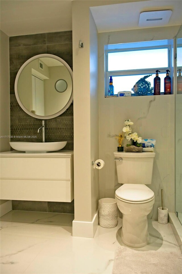 3849 NE 169th St Unit 302, North Miami Beach, FL 33160 - bathroom with vanity and decorative backsplash