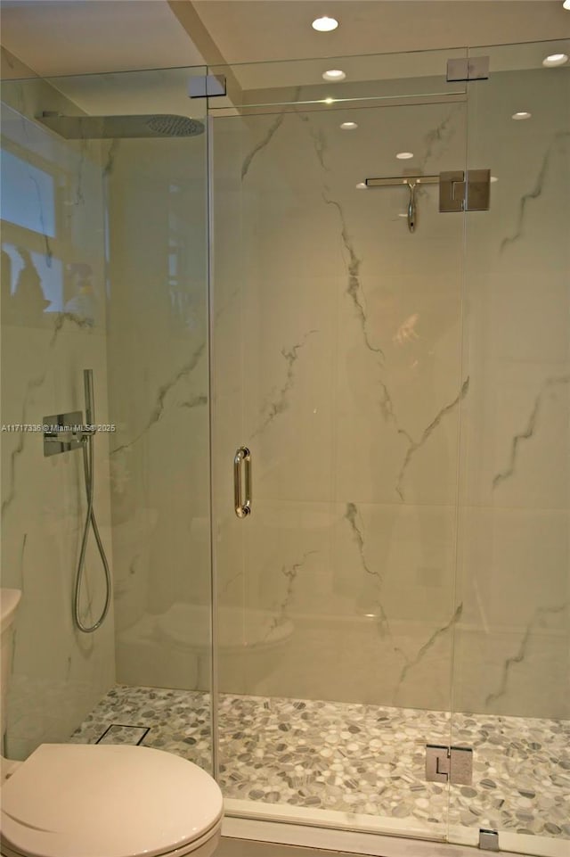 3849 NE 169th St Unit 302, North Miami Beach, FL 33160 - full bath with a marble finish shower and recessed lighting