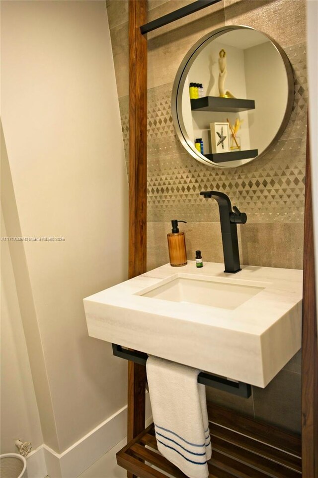 3849 NE 169th St Unit 302, North Miami Beach, FL 33160 - bathroom featuring tasteful backsplash