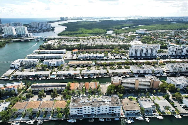 drone / aerial view featuring a water view and a city view