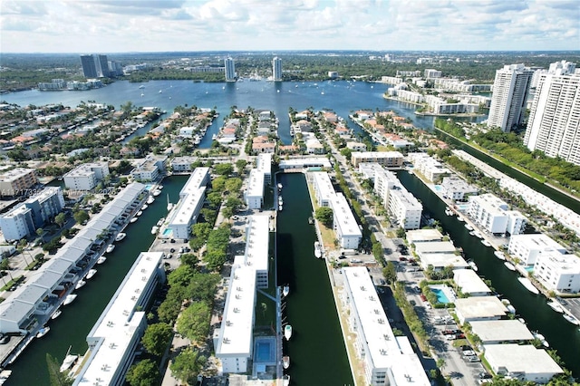 birds eye view of property with a view of city and a water view