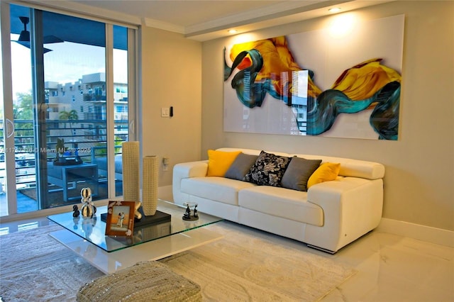 living room featuring floor to ceiling windows and ornamental molding