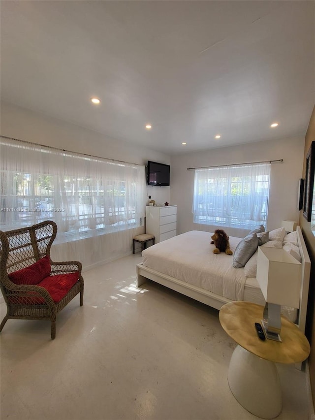 bedroom featuring concrete floors