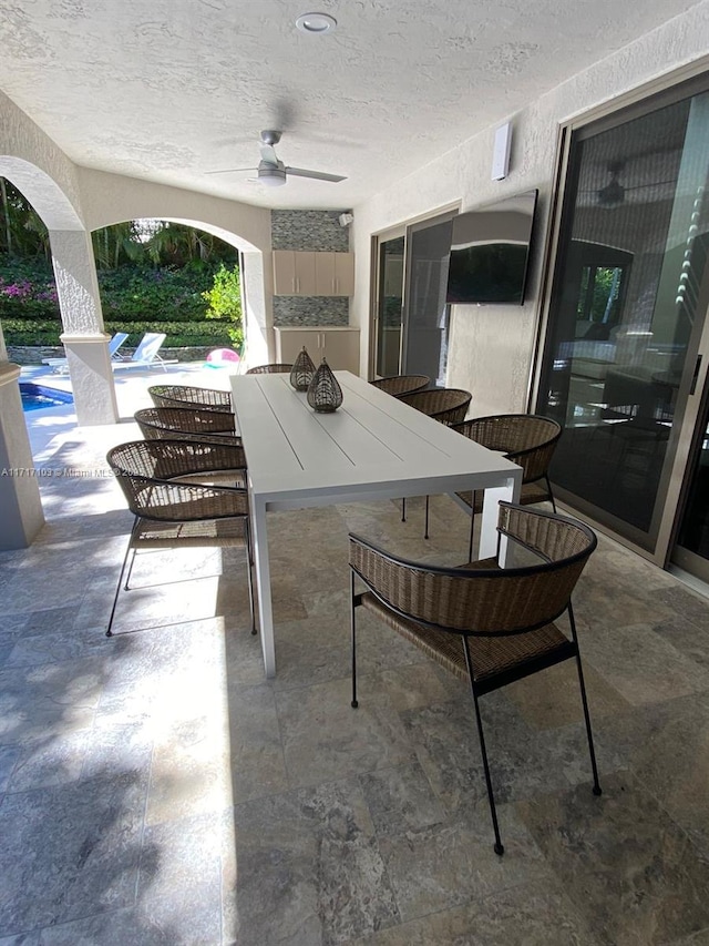 view of patio / terrace featuring ceiling fan