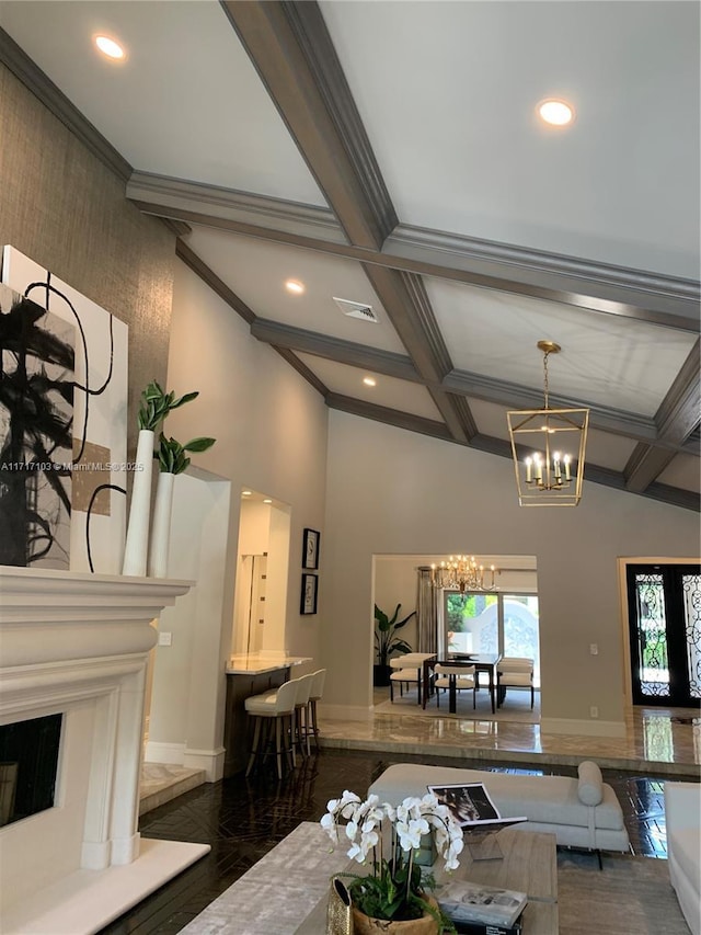 living room with coffered ceiling, beam ceiling, and an inviting chandelier