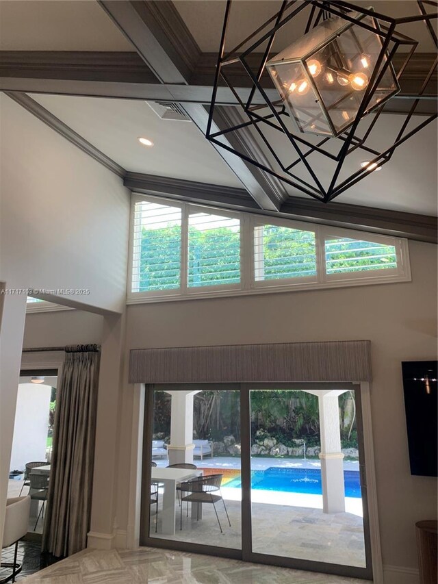 details with coffered ceiling and a swimming pool