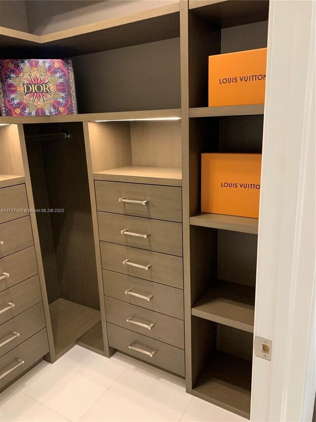 walk in closet featuring light tile patterned floors