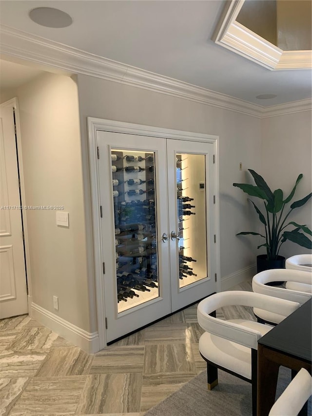 doorway featuring ornamental molding and french doors