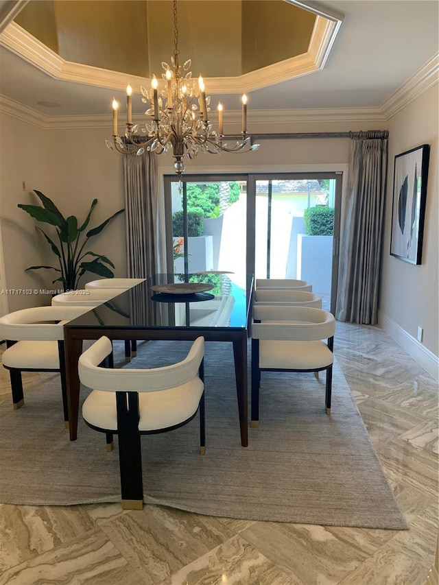 dining room featuring ornamental molding, a raised ceiling, and a wealth of natural light