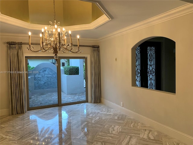 doorway with an inviting chandelier and crown molding