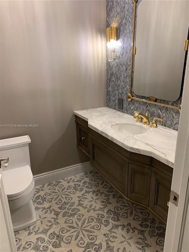 bathroom with vanity and toilet