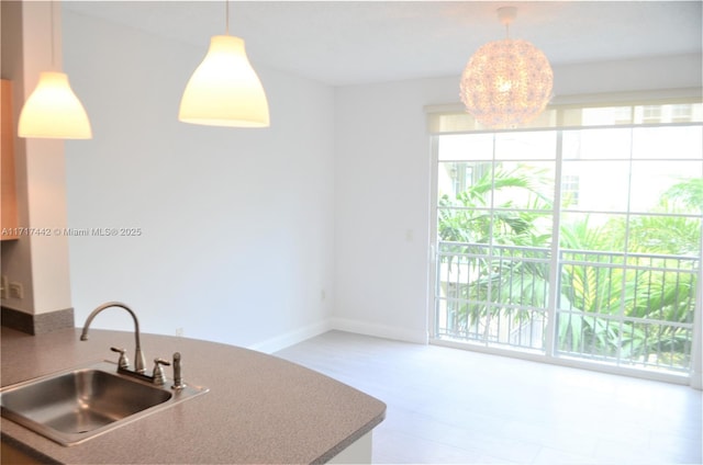 kitchen featuring pendant lighting and sink