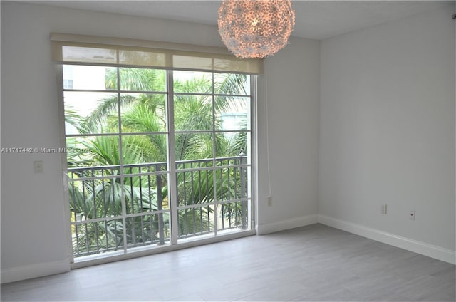 spare room featuring a chandelier