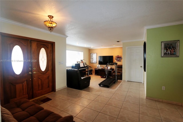 tiled entryway featuring crown molding