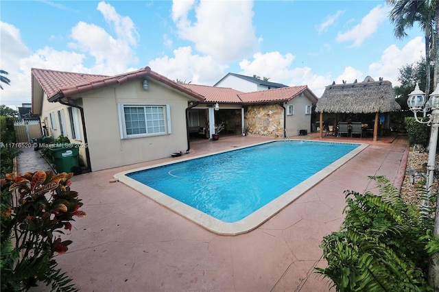 view of swimming pool with a gazebo and a patio