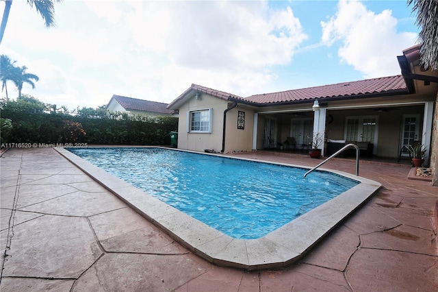 view of swimming pool with a patio