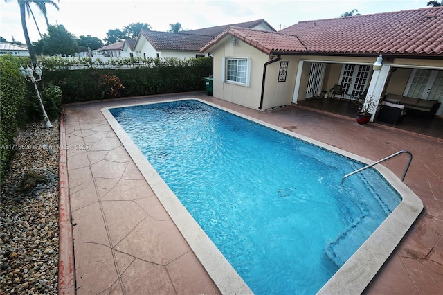 view of pool featuring a patio