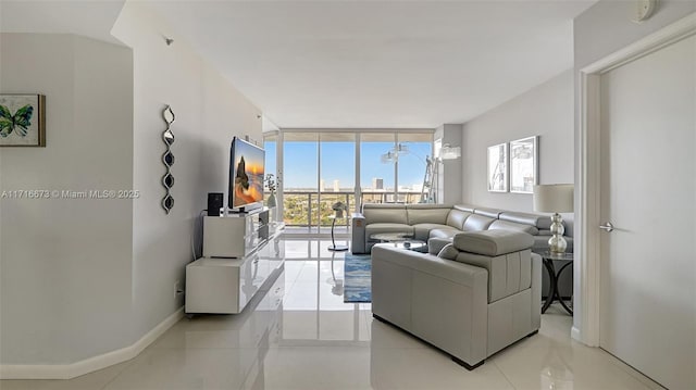 tiled living room with floor to ceiling windows