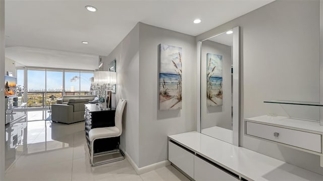 bathroom featuring tile patterned flooring and floor to ceiling windows