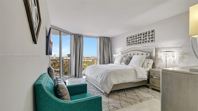 bedroom featuring expansive windows