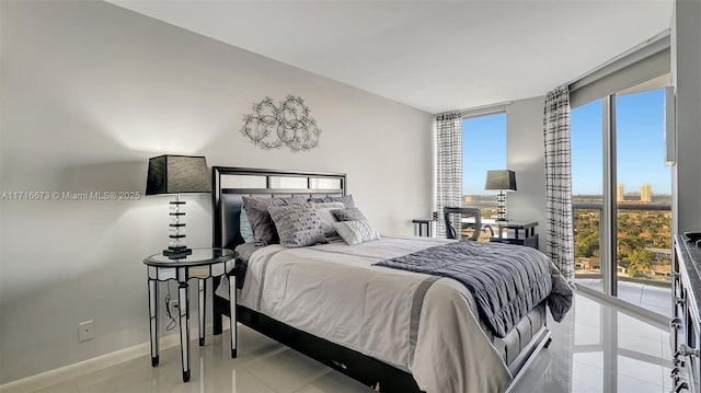 tiled bedroom with multiple windows and a wall of windows