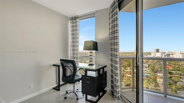 office space with light tile patterned floors and a wall of windows