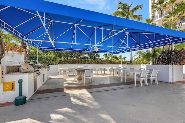 view of patio featuring exterior kitchen