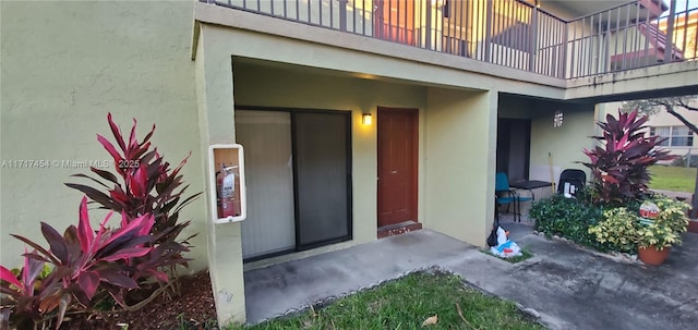 property entrance with a balcony