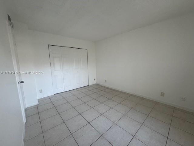 unfurnished bedroom with a closet