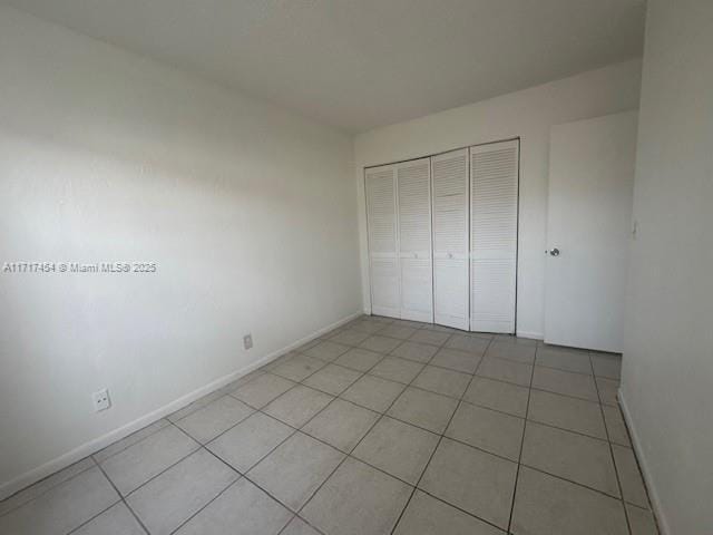 unfurnished bedroom featuring a closet