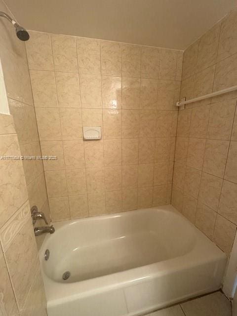 bathroom featuring tile patterned floors and shower / bathtub combination