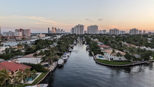 aerial view at dusk with a water view