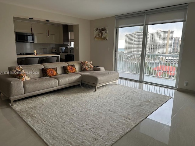 living room with light tile patterned floors and sink