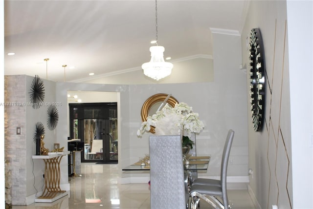 dining area featuring an inviting chandelier and ornamental molding