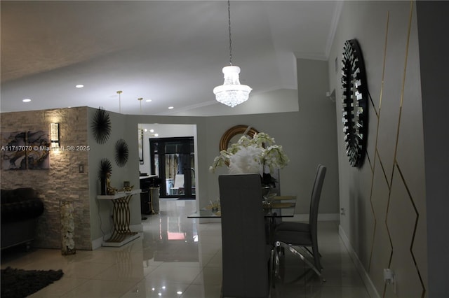 dining room featuring a notable chandelier, light tile patterned flooring, and crown molding